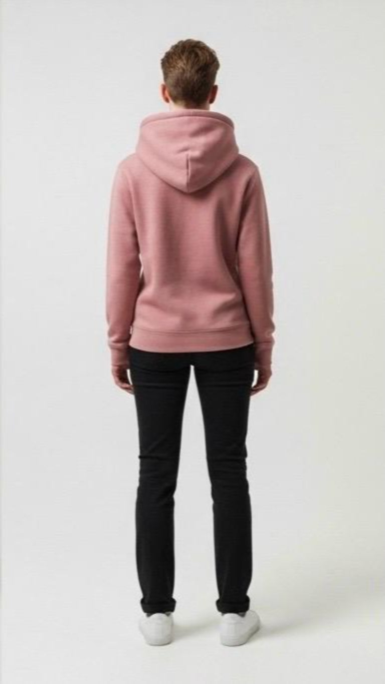 Person wearing a pink hoodie and black pants on a white background