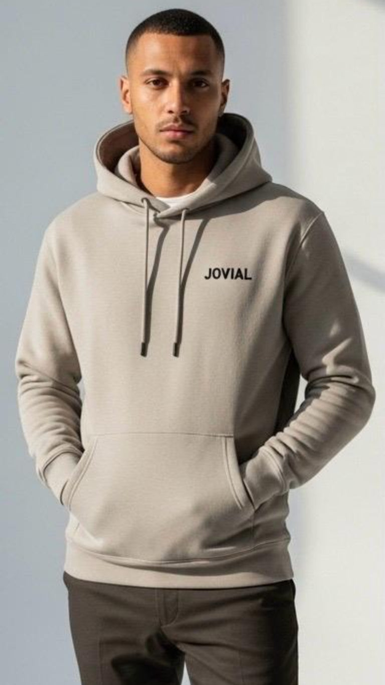 Man wearing a gray hoodie with 'JOVIAL' branding against a light background