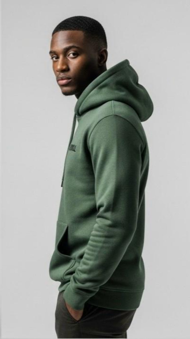 Man wearing a green hoodie against a plain background