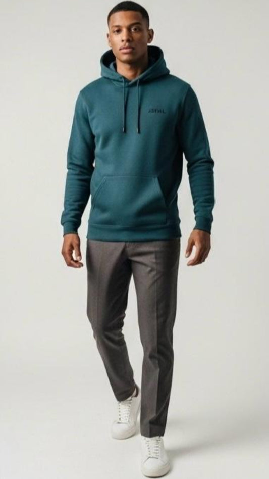 Man wearing a teal hoodie with a brand logo on a white background