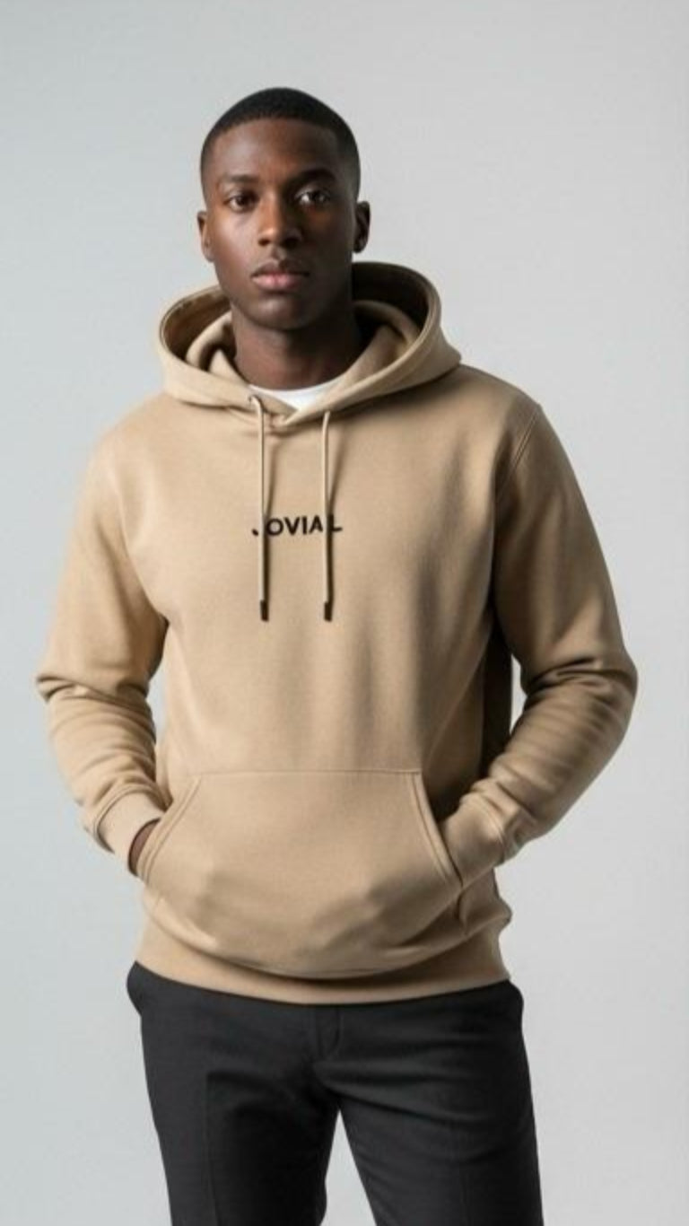 Person wearing a beige hoodie with 'JOVAIL' branding on a plain background