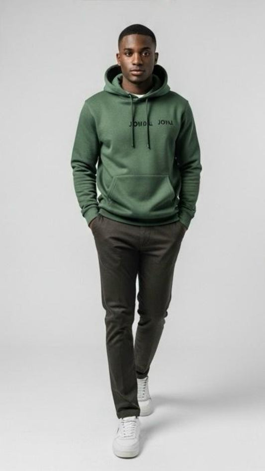 Person wearing a green hoodie with 'John John' branding on a white background