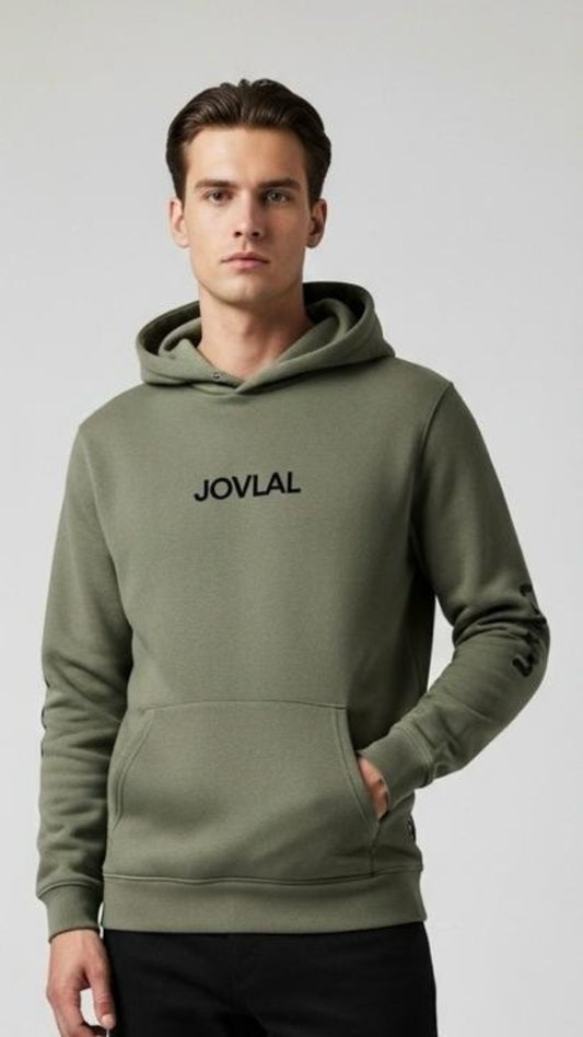 Man wearing a green hoodie with 'JOVAIL' branding on a white background