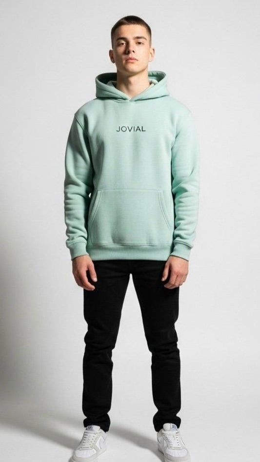 Person wearing a light green hoodie with 'JOVIAL' branding on a white background